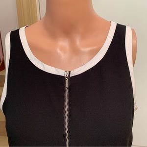 NAKED ZEBRA. Black mini dress with white border around neckline/arms. Sl…